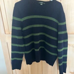 This is a J.Crew navy blue and green striped lambswool sweater.
